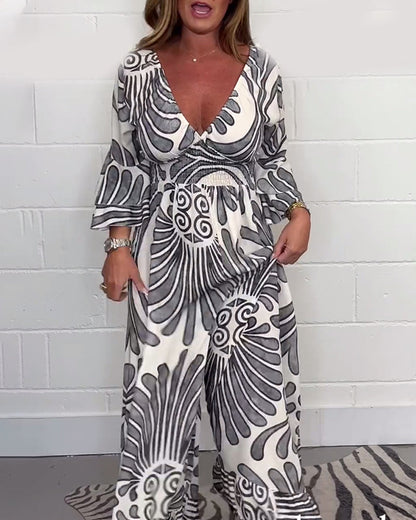 Lockerer jumpsuit mit tiefem v-retro-print und glockenärmeln