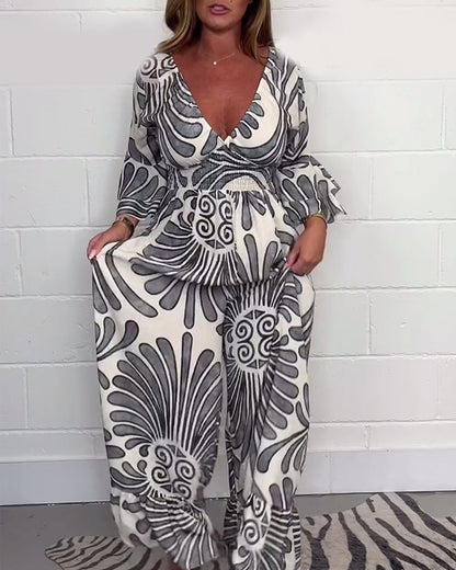 Lockerer jumpsuit mit tiefem v-retro-print und glockenärmeln